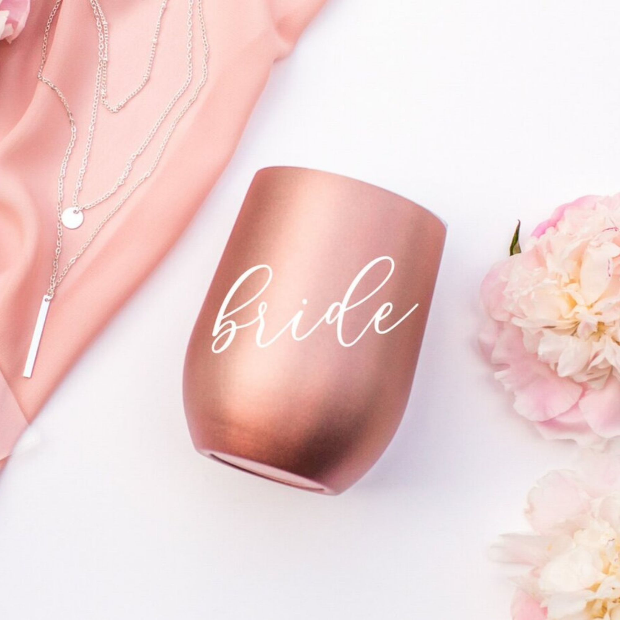 Personalized white tumbler with rose gold vinyl